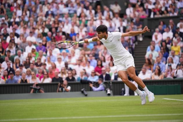 LONDON, ENGLAND - JULY 05: Carlos Alcaraz of Spain stretches to play a backhand against Frances Tiafoe of United States in his Gentlemen s Singles third round match during day five of The Championships Wimbledon 2024 at All England Lawn Tennis and Croquet Club on July 05, 2024 in London, England.  Copyright: xHiroshixSatox