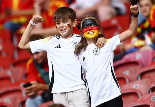 Germany fans with face paint in the stadium ahead of the game Spain v Germany, UEFA European Championship, EM, Europameisterschaft 2024, Quarter Final, Football, Stuttgart Arena, Stuttgart, Germany, 05 Jul 2024 EDITORIAL USE ONLY No use with unauthorised audio, video, data, fixture lists, club league logos or live services. Online in-match use limited to 120 images, no video emulation. No use in betting, games or single club league player publications.  Copyright: xMichaelxZemanek Shutterstockx 14571380d