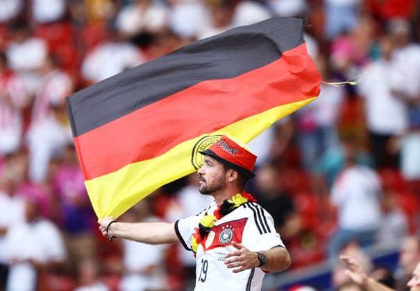 A German fan waves a flag in the stadium ahead of the game Spain v Germany, UEFA European Championship, EM, Europameisterschaft 2024, Quarter Final, Football, Stuttgart Arena, Stuttgart, Germany, 05 Jul 2024 EDITORIAL USE ONLY No use with unauthorised audio, video, data, fixture lists, club league logos or live services. Online in-match use limited to 120 images, no video emulation. No use in betting, games or single club league player publications.  Copyright: xMichaelxZemanek Shutterstockx 14571380t