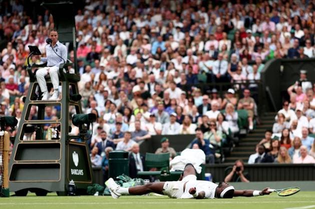 5th July 2024; All England Lawn Tennis and Croquet Club, London, England; Wimbledon Tennis Tournament, Day 5; Frances Tiafoe (USA) falls to the court during his third round match against Carlos Alcaraz (ESP)  ActionPlus12664162 ShaunxBrooks