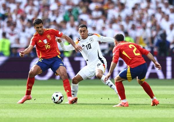 Rodri of Spain is challenged by Jamal Musiala of Germany Spain v Germany, UEFA European Championship, EM, Europameisterschaft 2024, Quarter Final, Football, Stuttgart Arena, Stuttgart, Germany, 05 Jul 2024 EDITORIAL USE ONLY No use with unauthorised audio, video, data, fixture lists, club league logos or live services. Online in-match use limited to 120 images, no video emulation. No use in betting, games or single club league player publications.  Copyright: xMichaelxZemanek Shutterstockx 14571380aq