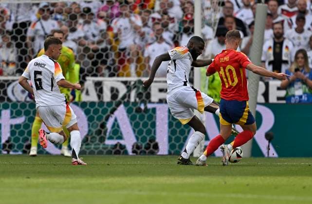 05 07 2024, Football UEFA EURO 2024, quarter-final, Spain Germany, in the Stuttgart Arena f l Josua Kimmich Germany , and Antonio Rüdiger Germany against Dani Olmo Spain