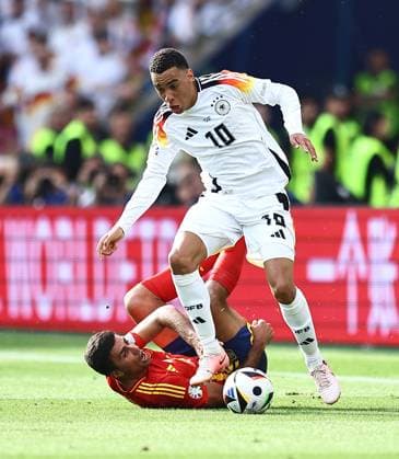 Rodri of Spain challenges Jamal Musiala of Germany Spain v Germany, UEFA European Championship, EM, Europameisterschaft 2024, Quarter Final, Football, Stuttgart Arena, Stuttgart, Germany, 05 Jul 2024 EDITORIAL USE ONLY No use with unauthorised audio, video, data, fixture lists, club league logos or live services. Online in-match use limited to 120 images, no video emulation. No use in betting, games or single club league player publications. Copyright: xMichaelxZemanek Shutterstockx 14571380bg