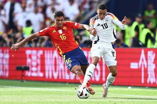 Rodri of Spain challenges Jamal Musiala of Germany Spain v Germany, UEFA European Championship, EM, Europameisterschaft 2024, Quarter Final, Football, Stuttgart Arena, Stuttgart, Germany, 05 Jul 2024 EDITORIAL USE ONLY No use with unauthorised audio, video, data, fixture lists, club league logos or live services. Online in-match use limited to 120 images, no video emulation. No use in betting, games or single club league player publications. Copyright: xMichaelxZemanek Shutterstockx 14571380be