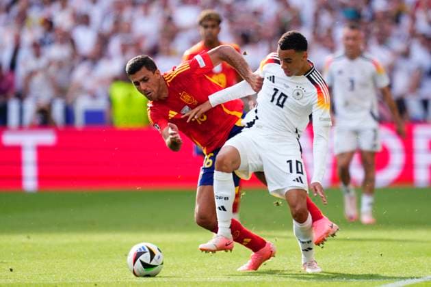 Spain v Germany: Quarter-Final - UEFA EURO, EM, Europameisterschaft,Fussball 2024 Jamal Musiala attacking midfield of Germany and Bayern Munich and Rodrigo Hernandez defensive midfield of Spain and Manchester City compete for the ball during the UEFA EURO 2024 quarter-final match between Spain and Germany at Stuttgart Arena on July 5, 2024 in Stuttgart, Germany. Stuttgart Germany  Copyright: xJosexBretonx originalFilename:bretonhernandez-spainvge240705_npgwX.jpg