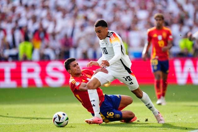 Spain v Germany: Quarter-Final - UEFA EURO, EM, Europameisterschaft,Fussball 2024 Jamal Musiala attacking midfield of Germany and Bayern Munich and Rodrigo Hernandez defensive midfield of Spain and Manchester City compete for the ball during the UEFA EURO 2024 quarter-final match between Spain and Germany at Stuttgart Arena on July 5, 2024 in Stuttgart, Germany. Stuttgart Germany  Copyright: xJosexBretonx originalFilename:bretonhernandez-spainvge240705_npiEz.jpg