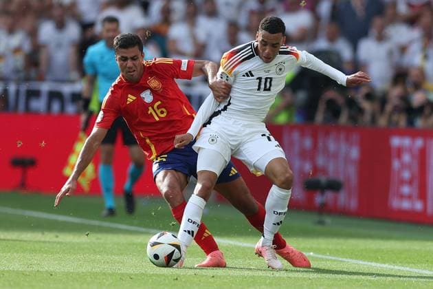 Soccer UEFA EURO 2024 Quarterfinal Spain Germany on 05 07 2024 at Stuttgart Arena in Stuttgart Rodri Spain , left Jamal Musiala Germany , right xMSx