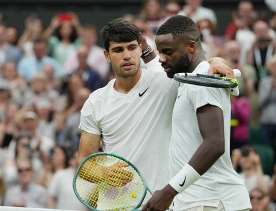 Lawn Tennis - 2024 Wimbledon Championship Mens singles Carlos Alcaraz (ESP) v Frances Tiafoe (USA) All England Lawn Tennis & Croquet Club - Friday 5th July 2024 Carlos Alcaraz (ESP) consols Tiafoe at the net after the match 