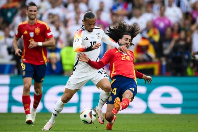 Spain v Germany - UEFA EURO, EM, Europameisterschaft,Fussball 2024 Leroy Sane of Germany is tackled by Marc Cucurella of Spain during the UEFA EURO 2024 quarter-final football match between Spain and Germany. Stuttgart Germany Copyright: xNicolòxCampox