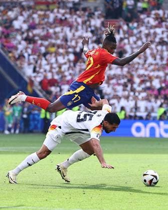 Nico Williams of Spain challenges Emre Can of Germany Spain v Germany, UEFA European Championship, EM, Europameisterschaft 2024, Quarter Final, Football, Stuttgart Arena, Stuttgart, Germany, 05 Jul 2024 EDITORIAL USE ONLY No use with unauthorised audio, video, data, fixture lists, club league logos or live services. Online in-match use limited to 120 images, no video emulation. No use in betting, games or single club league player publications. Copyright: xMichaelxZemanek Shutterstockx 14571380bm