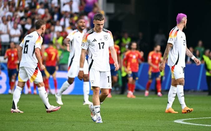 Football, European Championship, EURO 2024, Quarter-finals, MHP Arena Stuttgart Spain Germany Florian Wirtz GER , Joshua Kimmich GER , Jonathan Tah GER , Robert Andrich GER disappointed after the 1-0 goal by Dani Olmo SPA Disappointment, frustration, action