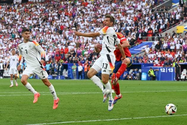 05 07 2024, xpsx, Football EM 2024 1 4 Final, Germany Spain emspor, v l Kai Havertz Germany, 7 , Aymeric Laporte Spain, 14 , Thomas Mueller Müller, Germany, 13 duel, duel, fight, tackle DFL DFB REGULATIONS PROHIBIT ANY USE OF PHOTOGRAPHS as IMAGE SEQUENCES and or QUASI VIDEO Stuttgart