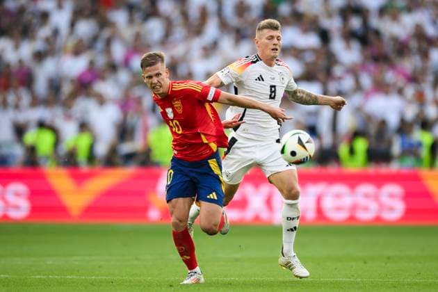 Spain v Germany - UEFA EURO, EM, Europameisterschaft,Fussball 2024 Dani Olmo of Spain competes for the ball with Toni Kroos of Germanyduring the UEFA EURO 2024 quarter-final football match between Spain and Germany. Stuttgart Germany Copyright: xNicolòxCampox