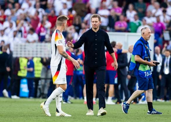 Stuttgart, MHPArena 05 07 2024 Head coach Julian Nagelsmann of germany comforts Toni Kroos of germany during the quarterfinal match Spain v Germany at the UEFA European Championship 2024