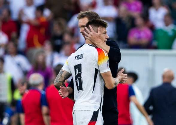 Stuttgart, MHPArena 05 07 2024 Head coach Julian Nagelsmann of germany comforts Toni Kroos of germany during the quarterfinal match Spain v Germany at the UEFA European Championship 2024