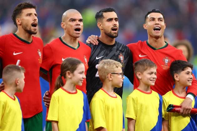 Cristiano Ronaldo of Portugal and team mates sing the national anthem Portugal v France, UEFA European Championship, EM, Europameisterschaft 2024, Quarter Final, Football, Volksparkstadion, Hamburg, Germany, 05 Jul 2024 EDITORIAL USE ONLY No use with unauthorised audio, video, data, fixture lists, club league logos or live services. Online in-match use limited to 120 images, no video emulation. No use in betting, games or single club league player publications.  Copyright: xKieranxMcManus Shutterstockx 14571382y