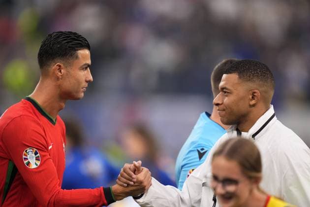 Portugal s Cristiano Ronaldo greets Kylian Mbappe of France during a quarterfinal match between Portugal and France at the Euro 2024 soccer tournament in Hamburg, Germany - Friday July 5, 2024. - Soccer .  Copyright: xFabioxFerrari LaPressex