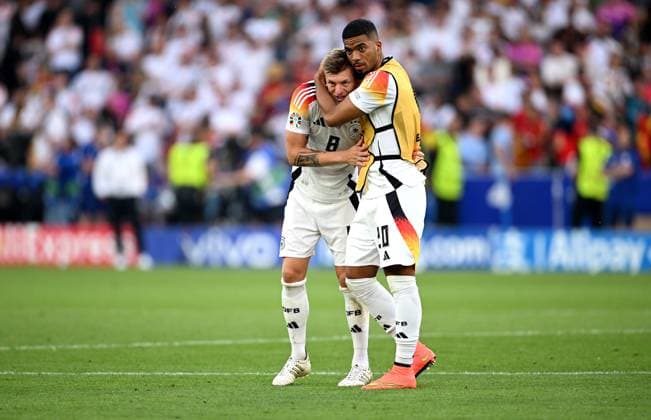 Football Euro 2024 quarter-finals 05 07 2024 Spain Germany Germanys disappointment at being knocked out of the tournament Toni Kroos with Benjamin Henrichs (left)