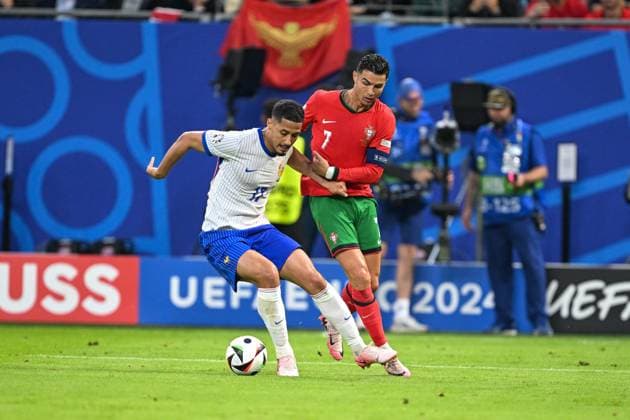 Euro 2024 Portugal France on 05 07 2024 at Volksparkstadion in Hamburg William Saliba 17 of France in a duel against Cristiano Ronaldo 7 of Portugal MT