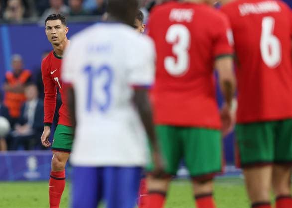 Hamburg, Germany, 5th July 2024. Cristiano Ronaldo of Portugal lines up a free kick during the UEFA European Championships Quarter Final match at Volksparkstadion, Hamburg. Picture credit should read: Paul Terry Sportimage EDITORIAL USE ONLY. No use with unauthorised audio, video, data, fixture lists, club league logos or live services. Online in-match use limited to 120 images, no video emulation. No use in betting, games or single club league player publications. SPI-3217-0037