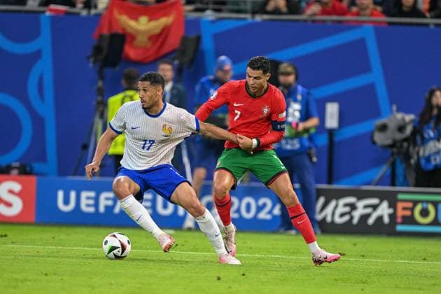 Euro 2024 Portugal France on 05 07 2024 at Volksparkstadion in Hamburg William Saliba 17 of France in a duel against Cristiano Ronaldo 7 of Portugal MT