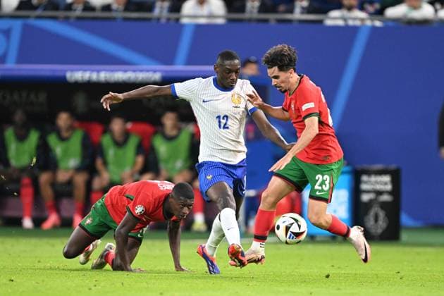 Euro 2024 Portugal France on 05 07 2024 at Volksparkstadion in Hamburg Randal Kolo Muani 12 of France in a duel against Vitinha 23 of Portugal MT