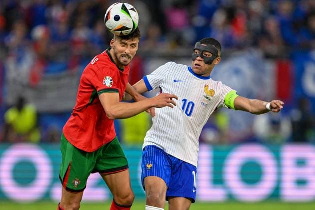 Euro 2024 Portugal France on 05 07 2024 at Volksparkstadion in Hamburg Ruben Dias 4 of Portugal in a duel against Kylian Mbappe 10 of France MT