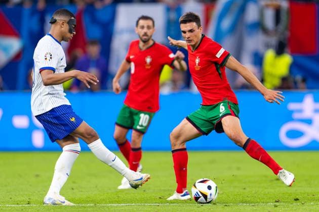 2024-07-05 Portugal v France - Quarter-Final - UEFA EURO, EM, Europameisterschaft,Fussball 2024 HAMBURG, GERMANY - JULY 5: Kylian Mbappe of France battles for the ball with Joao Palhinha of Portugal during the Quarter-Final - UEFA EURO 2024 match between Portugal and France at Volksparkstadion on July 5, 2024 in Hamburg, Germany. (Photo by Joris Verwijst BSR Agency) Hamburg Germany Content not available for redistribution in The Netherlands directly or indirectly through any third parties. Copyright: xBSRxAgencyx