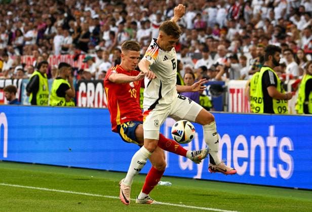 05 07 2024, xsltx, Football EM 2024 1 4 Final, Germany Spain emspor, v l Dani Olmo Spain , Joshua Kimmich Germany duel, action, action, battle for the ball DFL DFB REGULATIONS PROHIBIT ANY USE OF PHOTOGRAPHS as IMAGE SEQUENCES and or QUASI VIDEO Stuttgart