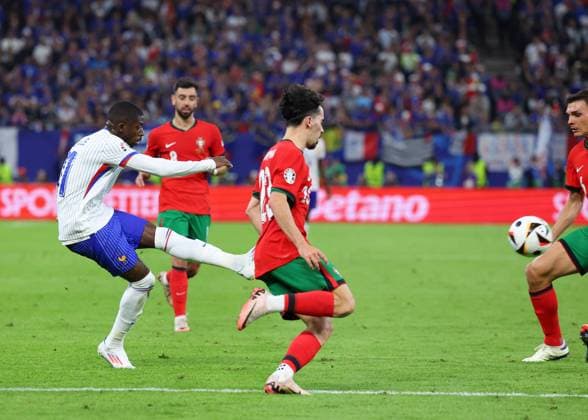 Hamburg, Germany, 5th July 2024. Ousmane Dembele of France shoots and misses the target during the UEFA European Championships Quarter Final match at Volksparkstadion, Hamburg. Picture credit should read: Paul Terry Sportimage EDITORIAL USE ONLY. No use with unauthorised audio, video, data, fixture lists, club league logos or live services. Online in-match use limited to 120 images, no video emulation. No use in betting, games or single club league player publications. SPI-3217-0048