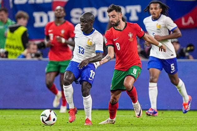 2024-07-05 Portugal v France - Quarter-Final - UEFA EURO, EM, Europameisterschaft,Fussball 2024 HAMBURG, GERMANY - JULY 5: N Golo Kante of France, Bruno Fernandes of Portugal battle for the ball during the Quarter-Final - UEFA EURO 2024 match between Portugal and France at Volksparkstadion on July 5, 2024 in Hamburg, Germany. (Photo by Joris Verwijst BSR Agency) Hamburg Germany Content not available for redistribution in The Netherlands directly or indirectly through any third parties. Copyright: xBSRxAgencyx