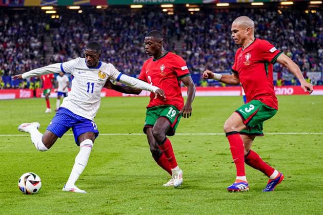 2024-07-05 Portugal v France - Quarter-Final - UEFA EURO, EM, Europameisterschaft,Fussball 2024 HAMBURG, GERMANY - JULY 5: Ousmane Dembele of France shoots and Nuno Mendes of Portugal, Pepe of Portugal try to block it during the Quarter-Final - UEFA EURO 2024 match between Portugal and France at Volksparkstadion on July 5, 2024 in Hamburg, Germany. (Photo by Joris Verwijst BSR Agency) Hamburg Germany Content not available for redistribution in The Netherlands directly or indirectly through any third parties. Copyright: xBSRxAgencyx