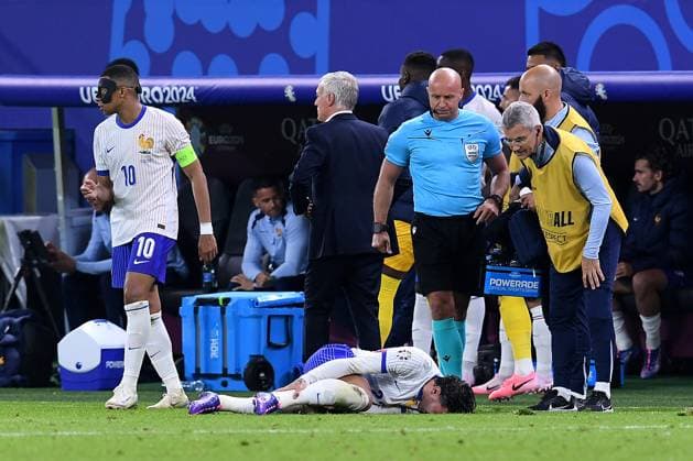 Soccer UEFA EURO 2024 quarter final Portugal France on 05 07 2024 at Volksparkstadion Hamburg in Hamburg Theo Hernandez France injured on the ground Injury xRx