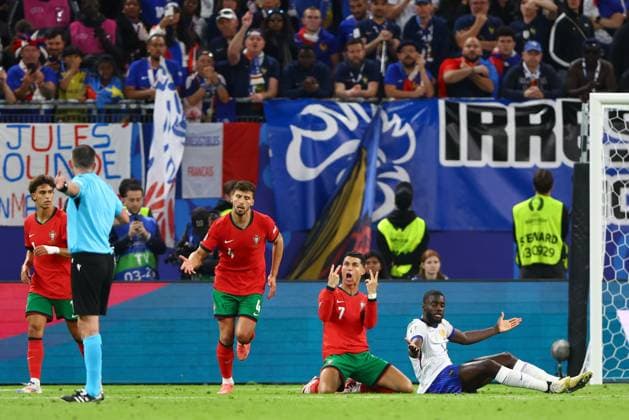 Cristiano Ronaldo of Portugal reacts to referee Michael Oliver Portugal v France, UEFA European Championship, EM, Europameisterschaft 2024, Quarter Final, Football, Volksparkstadion, Hamburg, Germany, 05 Jul 2024 EDITORIAL USE ONLY No use with unauthorised audio, video, data, fixture lists, club league logos or live services. Online in-match use limited to 120 images, no video emulation. No use in betting, games or single club league player publications. Copyright: xKieranxMcManus Shutterstockx 14571382cp