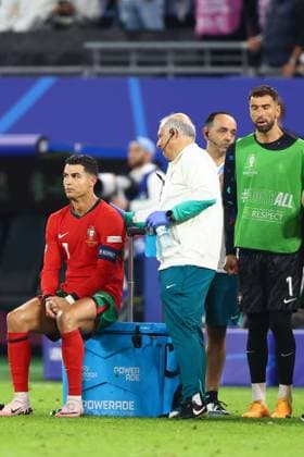 Cristiano Ronaldo of Portugal receives treatment prior to penalties Portugal v France, UEFA European Championship, EM, Europameisterschaft 2024, Quarter Final, Football, Volksparkstadion, Hamburg, Germany, 05 Jul 2024 EDITORIAL USE ONLY No use with unauthorised audio, video, data, fixture lists, club league logos or live services. Online in-match use limited to 120 images, no video emulation. No use in betting, games or single club league player publications. Copyright: xKieranxMcManus Shutterstockx 14571382cs