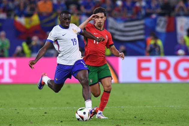 Soccer UEFA EURO 2024 Quarterfinal Portugal France on 05 07 2024 at Volksparkstadion Hamburg in Hamburg Youssouf Fofana France , left Joao Felix Portugal , right xRx