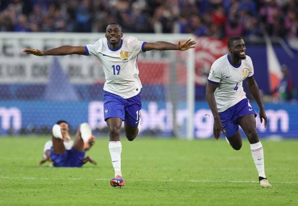 Hamburg, Germany, 5th July 2024. Youssouf Fofana of France (l) and Dayot Upamecano of France (r) ead the celebrations after winning the penalty shoot out during the UEFA European Championships Quarter Final match at Volksparkstadion, Hamburg. Picture credit should read: Paul Terry Sportimage EDITORIAL USE ONLY. No use with unauthorised audio, video, data, fixture lists, club league logos or live services. Online in-match use limited to 120 images, no video emulation. No use in betting, games or single club league player publications. SPI-3217-0065