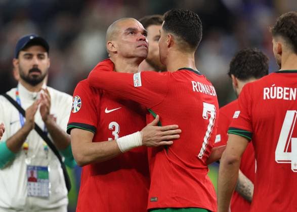 Hamburg, Germany, 5th July 2024. Pepe of Portugal consoled by Cristiano Ronaldo of Portugal after loosing the the penalty shot out during the UEFA European Championships Quarter Final match at Volksparkstadion, Hamburg. Picture credit should read: Paul Terry Sportimage EDITORIAL USE ONLY. No use with unauthorised audio, video, data, fixture lists, club league logos or live services. Online in-match use limited to 120 images, no video emulation. No use in betting, games or single club league player publications. SPI-3217-0068