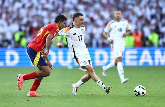 Florian Wirtz of Germany and Rodri of Spain Spain v Germany, UEFA European Championship, EM, Europameisterschaft 2024, Quarter Final, Football, Stuttgart Arena, Stuttgart, Germany, 05 Jul 2024 EDITORIAL USE ONLY No use with unauthorised audio, video, data, fixture lists, club league logos or live services. Online in-match use limited to 120 images, no video emulation. No use in betting, games or single club league player publications. Copyright: xMichaelxZemanek Shutterstockx 14571380ht