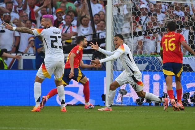 from left Robert Andrich GER nd Jamal MUSIALA GER claim a handball by Marc CUCURELLA ESP no penalty,penalty kick quarterfinal Spain ESP Germany GER 2 1 n V on 05 07 2024,Stuttgart Arena, Soccer UEFA EURO 2024 GERMANY from 14 06 2024 14 07 2024