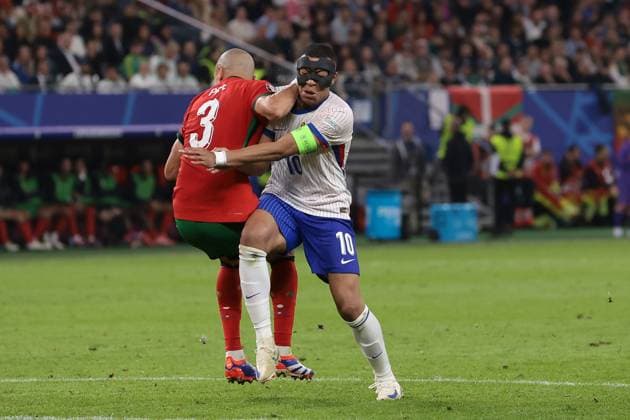 Hamburg, Germany, 5th July 2024. Pepe of Portugal clashes with Kylian Mbappe of France during the UEFA European Championships quarter final match at Volksparkstadion, Hamburg. Picture credit should read: Jonathan Moscrop Sportimage EDITORIAL USE ONLY. No use with unauthorised audio, video, data, fixture lists, club league logos or live services. Online in-match use limited to 120 images, no video emulation. No use in betting, games or single club league player publications. SPI-3219-0021