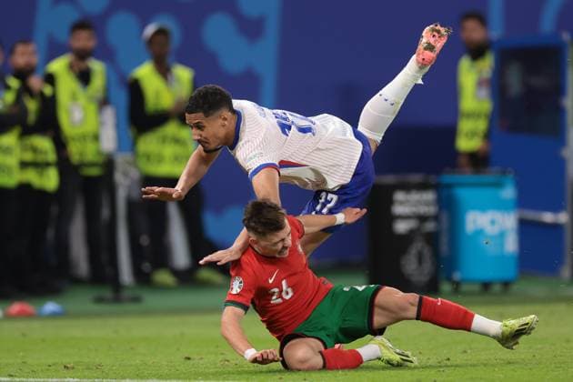 Hamburg, Germany, 5th July 2024. William Saliba of France clashes with Francisco Conceicao of Portugal during the UEFA European Championships quarter final match at Volksparkstadion, Hamburg. Picture credit should read: Jonathan Moscrop Sportimage EDITORIAL USE ONLY. No use with unauthorised audio, video, data, fixture lists, club league logos or live services. Online in-match use limited to 120 images, no video emulation. No use in betting, games or single club league player publications. SPI-3219-0045