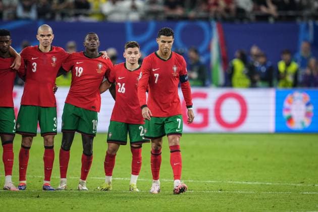 (240706) -- HAMBURG, July 6, 2024 -- Cristiano Ronaldo of Portugal walks to the position before kicking the penalty kick in the penalty shootout during the UEFA EURO, EM, Europameisterschaft,Fussball 2024 quarter-final match between Portugal and France in Hamburg, Germany on July 5, 2024. ) (SP)GERMANY-HAMBURG-FOOTBALL-EURO 2024-QUARTER FINAL-PORTUGAL VS FRANCE PanxYulong 