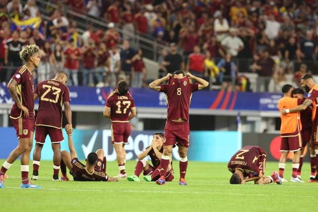 Venezuela™s soccer players react after losing by penalty definition against Canada during the Copa America USA 2024 quarterfinal match at AT T Stadium in Arlington, TX, on July 5, 2024 Canada won and qualified to face Argentina in semifinals in New Jersey on July 9 ARLINGTON UNITED STATES Copyright: xALEJANDROxPAGNIx