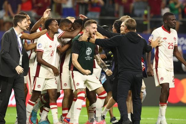 Canada s soccer players celebrate after defeating Venezuela by penalty kick during the Copa AmÃ rica USA 2024 quarterfinal match at AT T Stadium in Arlington, TX, on July 5, 2024 Canada qualified to face Argentina in semifinals in New Jersey on July 9 ARLINGTON UNITED STATES Copyright: xALEJANDROxPAGNIx