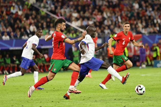 Portugal v France: Quarter-Final - UEFA EURO, EM, Europameisterschaft,Fussball 2024 Bruno Fernandes of Portugal (L) and Ngolo Kante of France (R) are playing during the UEFA Euro 2024 quarter-final football match between France and Portugal at Volksparkstadion Stadium in Hamburg, Germany. Hamburg Germany  Copyright: xIbrahimxEzzatx originalFilename:ezzat-notitle240705_npV4G.jpg