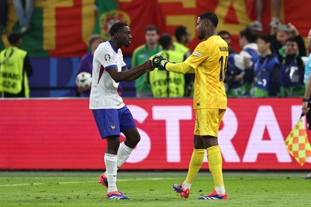 Youssouf Fofana (France) Mike Maignan (France) during the UEFA EURO, EM, Europameisterschaft,Fussball Germany 2024 match between Portugal 4-5 France at Volkspakstadion on July 05, 2024 in Hamburg , Germany. Noxthirdxpartyxsales  (258789588)