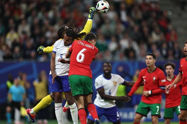 Mike Maignan (France) Jules Kounde (France) Joao Palhinha (Portugal) during the UEFA EURO, EM, Europameisterschaft,Fussball Germany 2024 match between Portugal 4-5 France at Volkspakstadion on July 05, 2024 in Hamburg , Germany. Noxthirdxpartyxsales  (258789922)