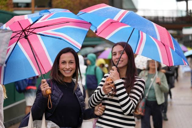 Lawn Tennis - 2024 Wimbledon Championship Mens singles Cameron Norrie GBR) v Alexander Zverev (GER) All England Lawn Tennis & Croquet Club - Saturday 6th July 2024 Rain delays with Umbrellas 