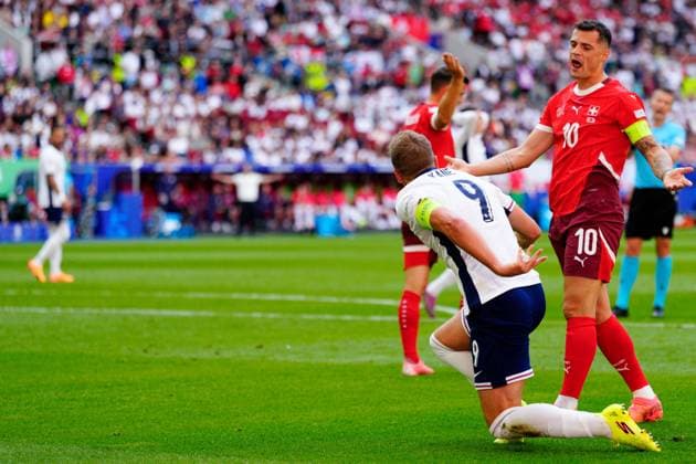 Granit Xhaka of Switzerland and Harry Kane of England England v Switzerland, UEFA European Championship, EM, Europameisterschaft 2024, Quarter Final, Football, Dusseldorf Arena, Dusseldorf, Germany, 06 Jul 2024 EDITORIAL USE ONLY No use with unauthorised audio, video, data, fixture lists, club league logos or live services. Online in-match use limited to 120 images, no video emulation. No use in betting, games or single club league player publications. Copyright: xDavexShopland Shutterstockx 14571391ag